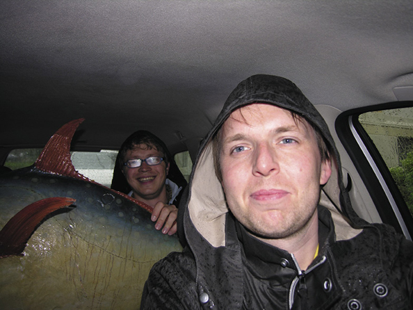 Møllerhaug created numerous projects with fellow artist Espen Sommer Eide. Here they're on their way to a performance of Archive Circus (Rural Readers) Møllerhaug takes care of a 100 years old moon fish in the back seat. 